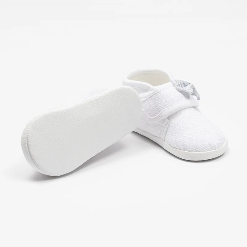 New Baby Kojenecké capáčky s mašličkou bílá 12-18 m