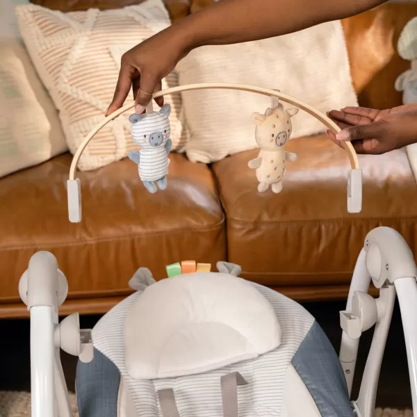 INGENUITY Houpačka konvertibilní s melodií Swing'n Go Chambray 0m+ do 9kg